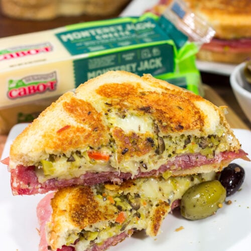 Celebrate National Grilled Cheese Month with a New Orleans flare! This Muffaletta Grilled Cheese sandwich combines two favorites into one!