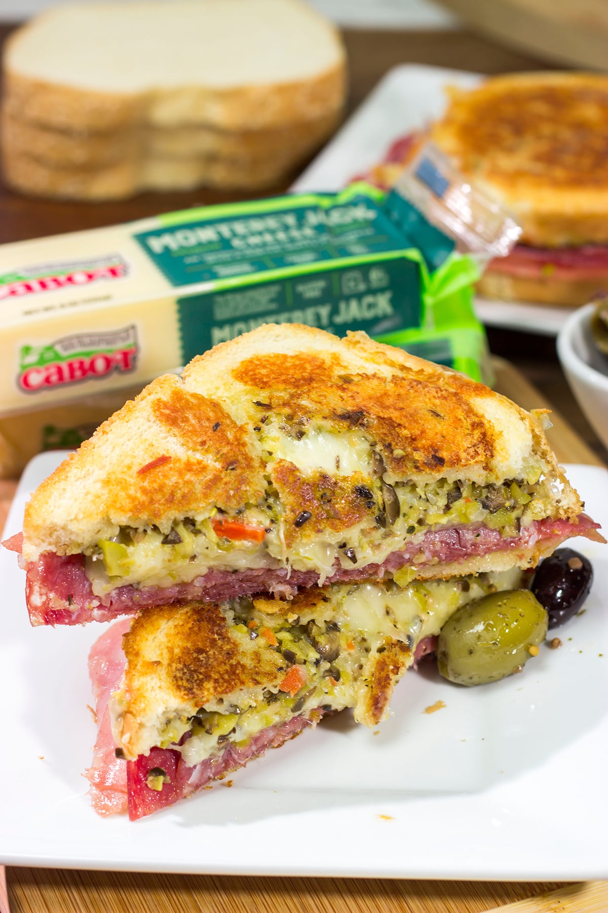 Celebrate National Grilled Cheese Month with a New Orleans flare! This Muffaletta Grilled Cheese sandwich combines two favorites into one!