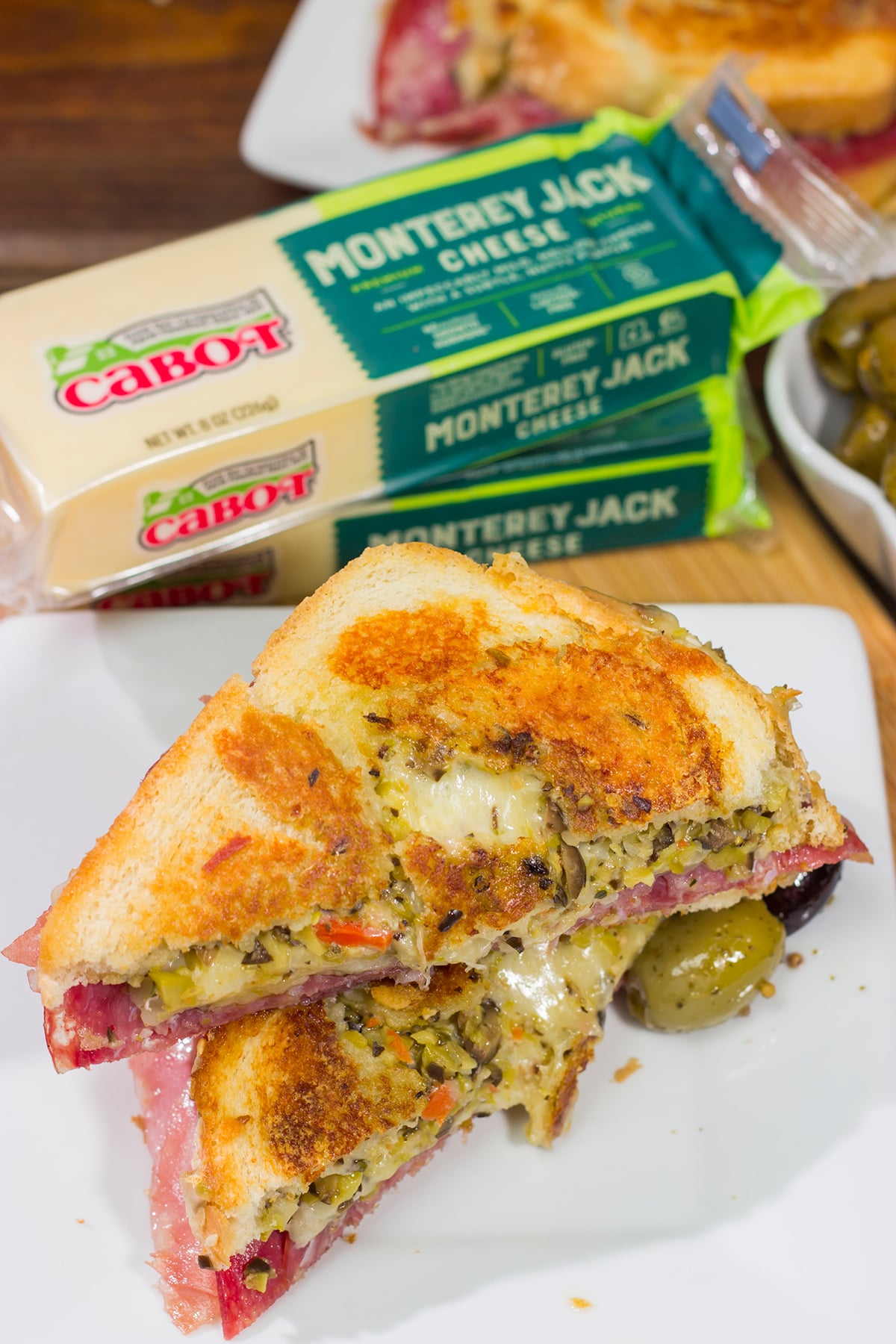 Celebrate National Grilled Cheese Month with a New Orleans flare! This Muffaletta Grilled Cheese sandwich combines two favorites into one!