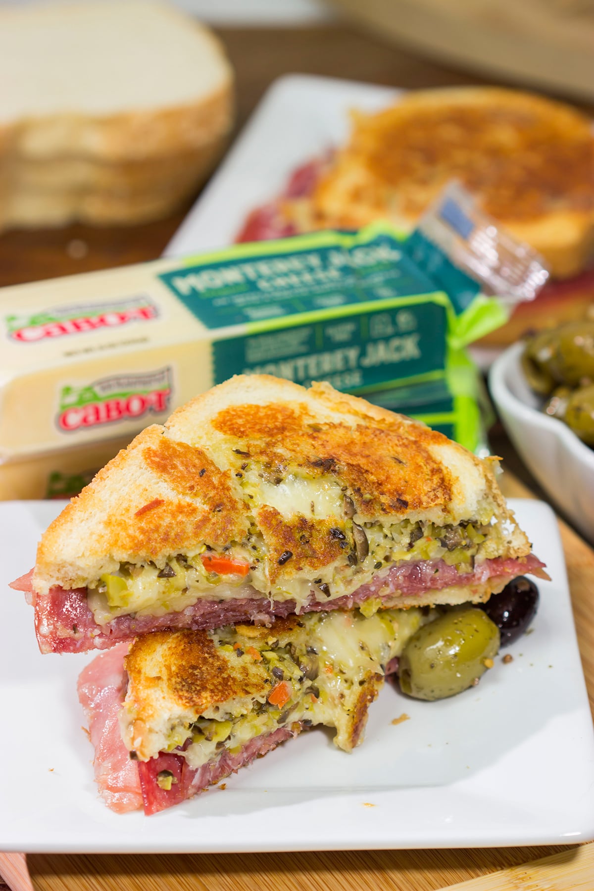 Celebrate National Grilled Cheese Month with a New Orleans flare! This Muffaletta Grilled Cheese sandwich combines two favorites into one!