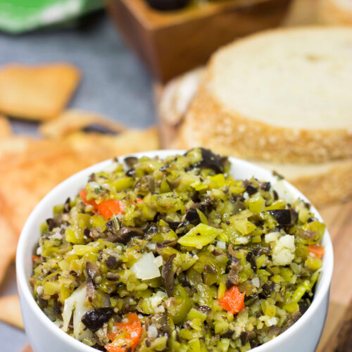 Often used in the classic New Orleans sandwich, a good Muffaletta Olive Salad is delicious in its own right. Spread it on top of grilled chicken or serve with pita chips as a dip!