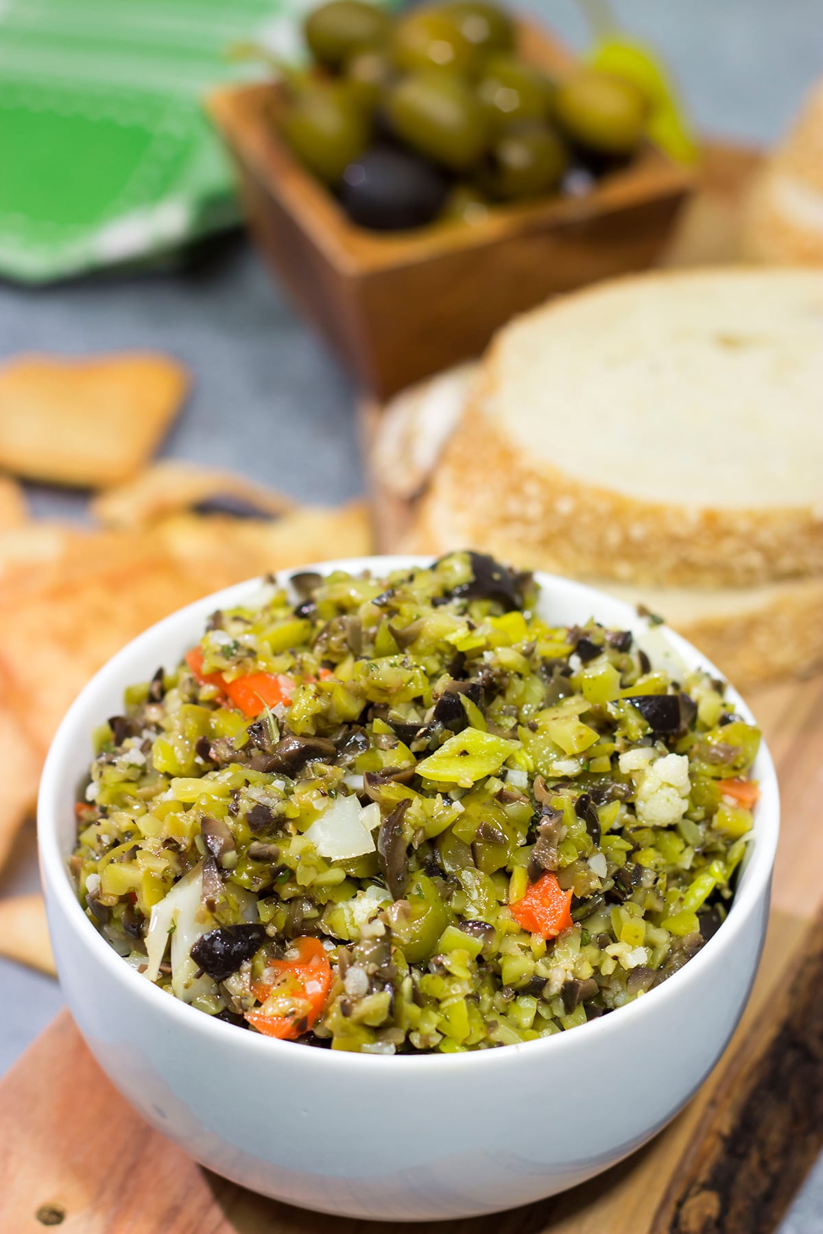 Often used in the classic New Orleans sandwich, a good Muffaletta Olive Salad is delicious in its own right. Spread it on top of grilled chicken or serve with pita chips as a dip!