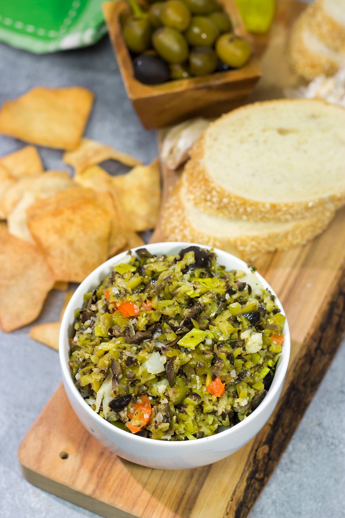 Often used in the classic New Orleans sandwich, a good Muffaletta Olive Salad is delicious in its own right. Spread it on top of grilled chicken or serve with pita chips as a dip!