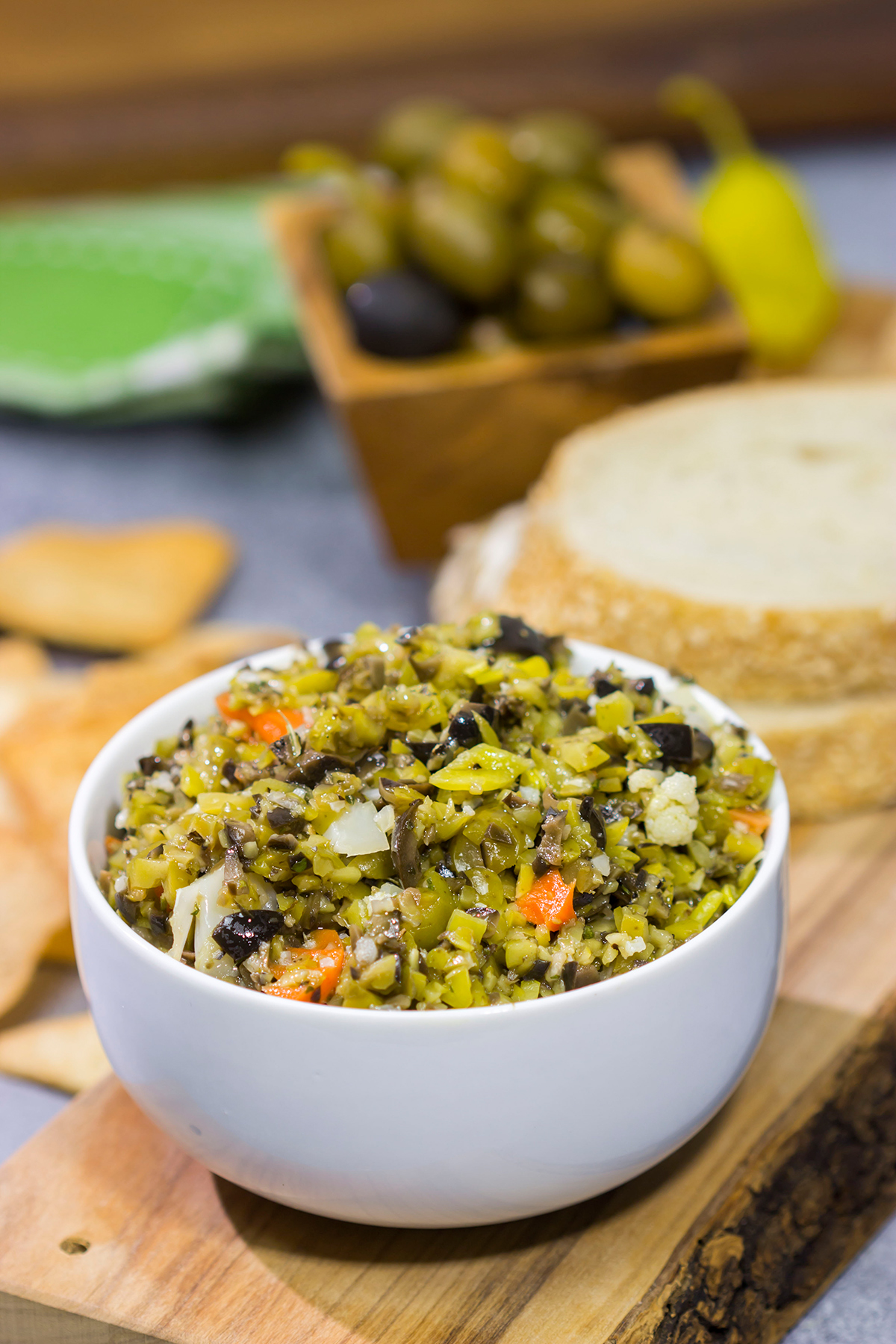 Often used in the classic New Orleans sandwich, a good Muffaletta Olive Salad is delicious in its own right. Spread it on top of grilled chicken or serve with pita chips as a dip!