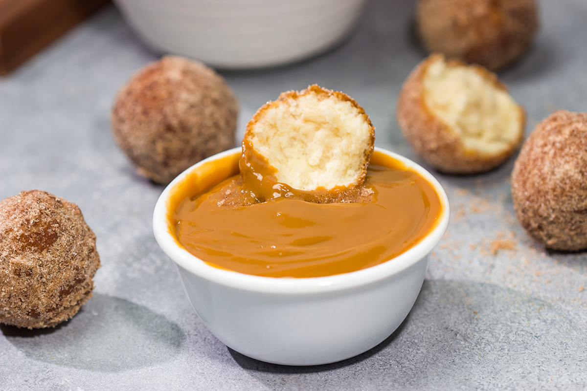 Served with homemade dulce de leche for dipping, these Snickerdoodle Donut Holes are packed with cinnamon sugar flavor!