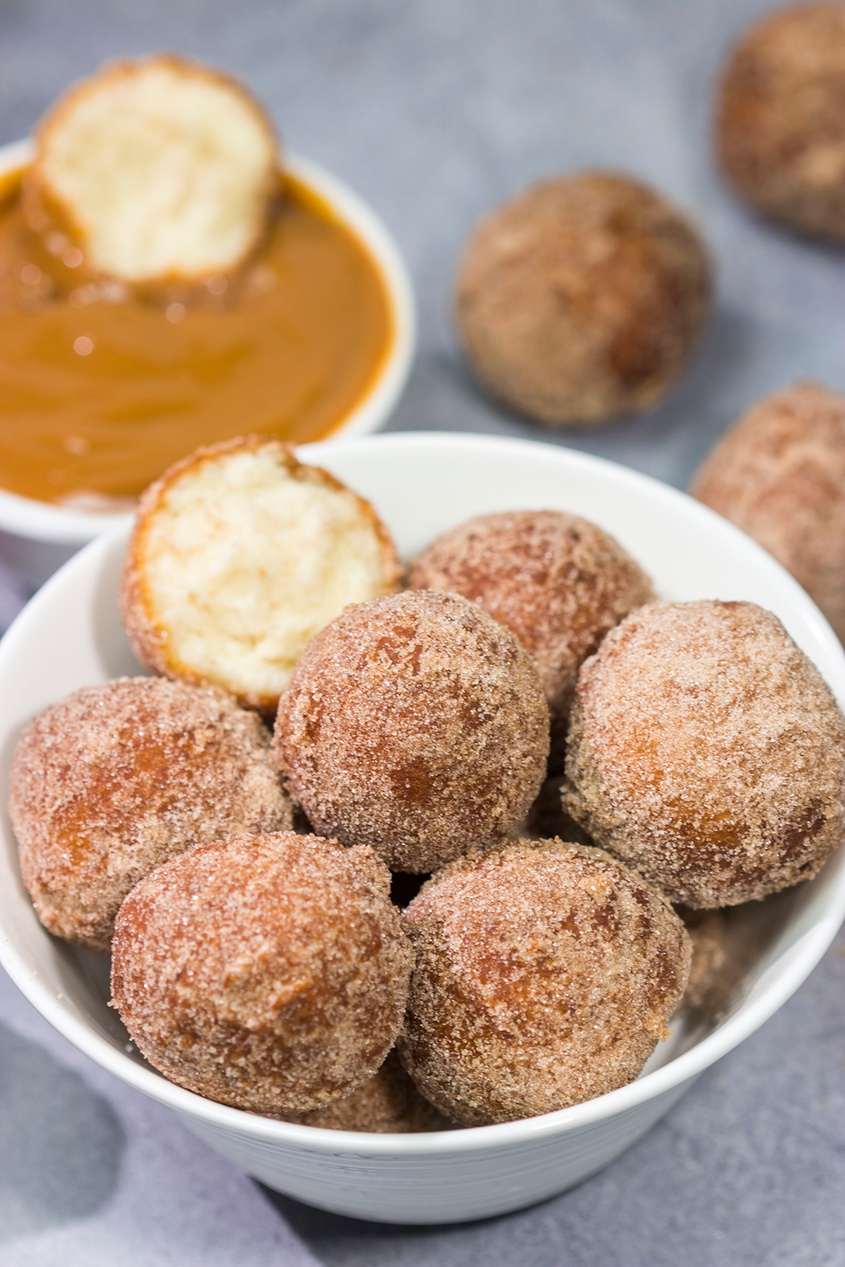 Served with homemade dulce de leche for dipping, these Snickerdoodle Donut Holes are packed with cinnamon sugar flavor!