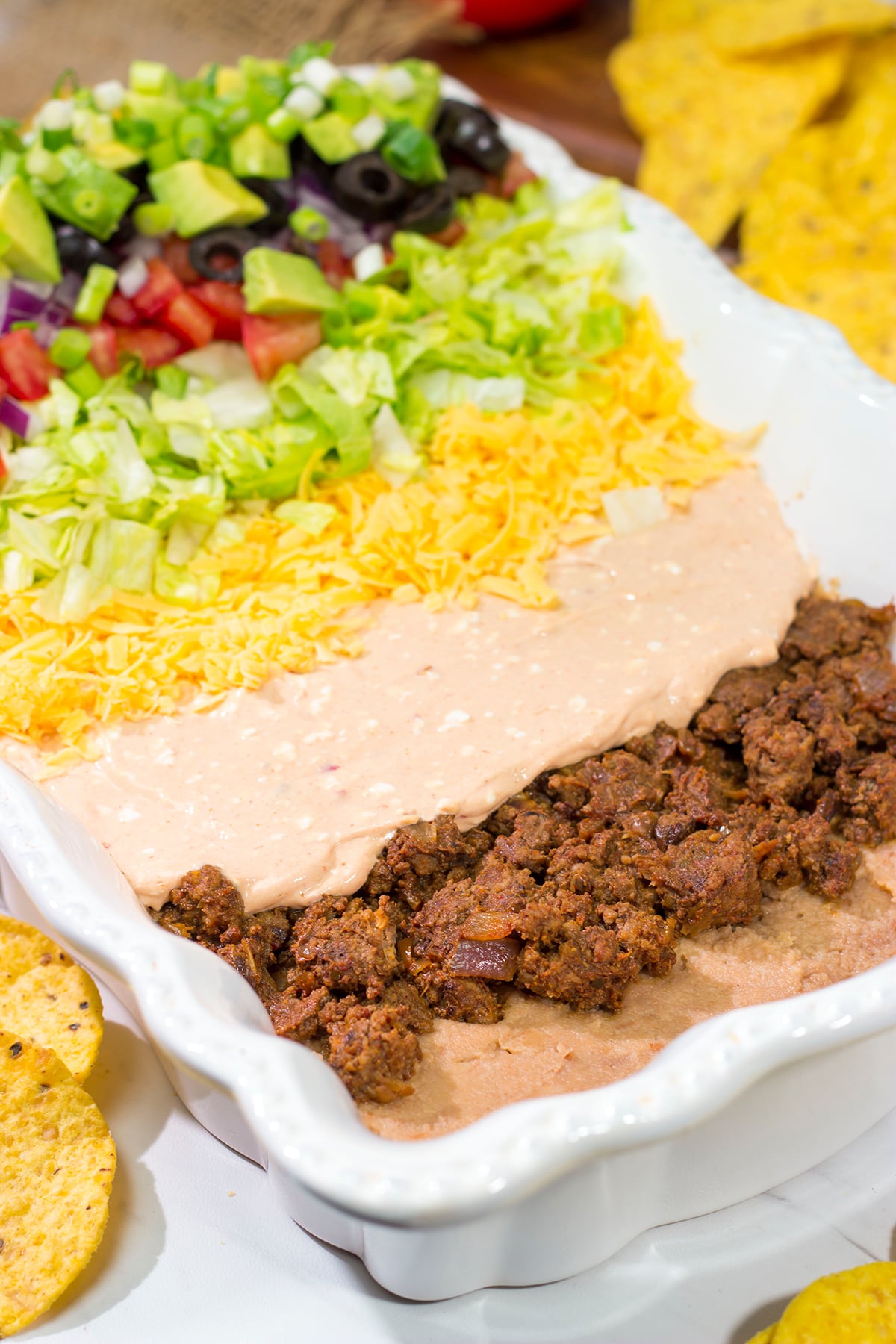 Featuring 10 layers of deliciousness, this Taco Salad Dip is a classic appetizer that is always a crowd pleaser!