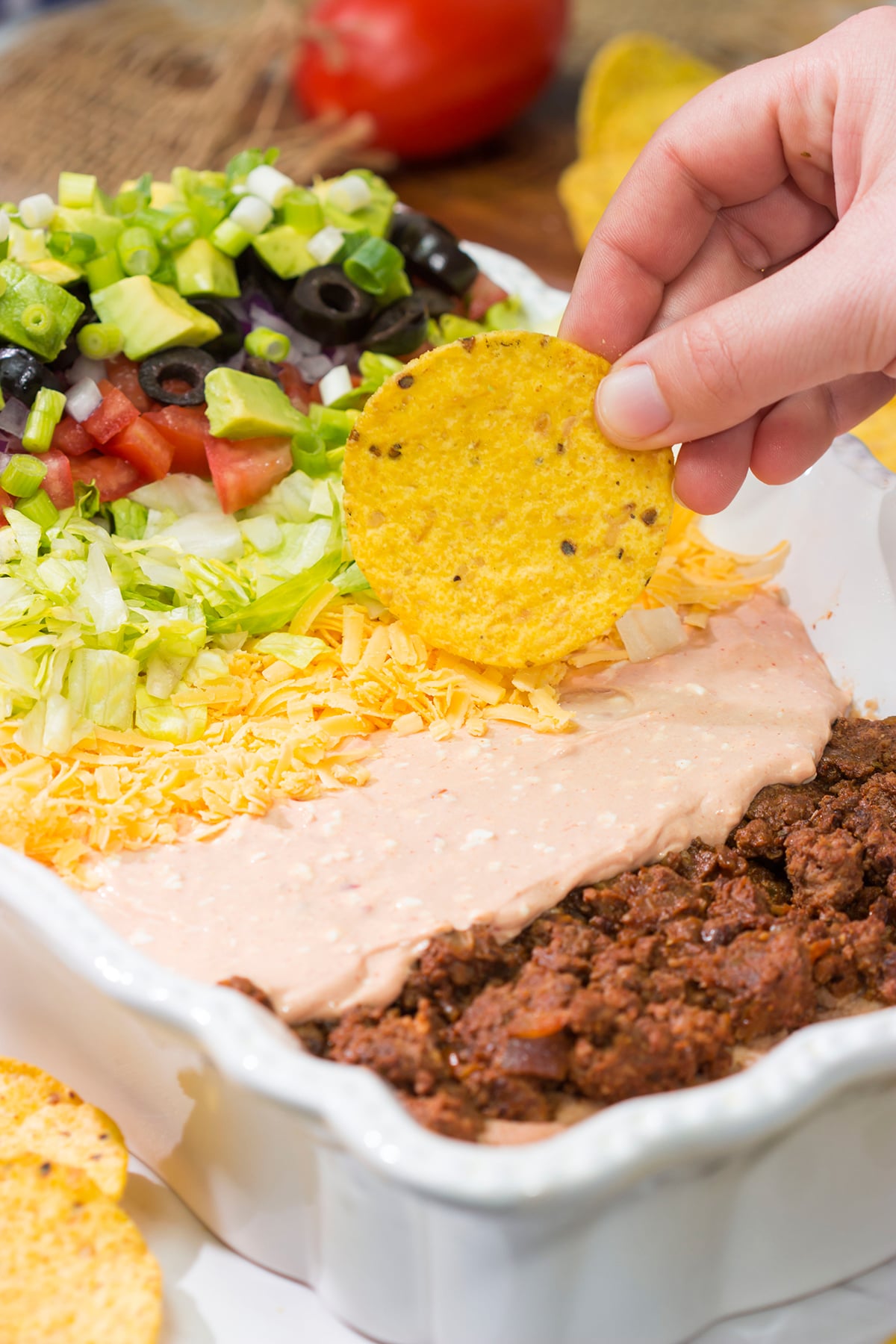 Featuring 10 layers of deliciousness, this Taco Salad Dip is a classic appetizer that is always a crowd pleaser!