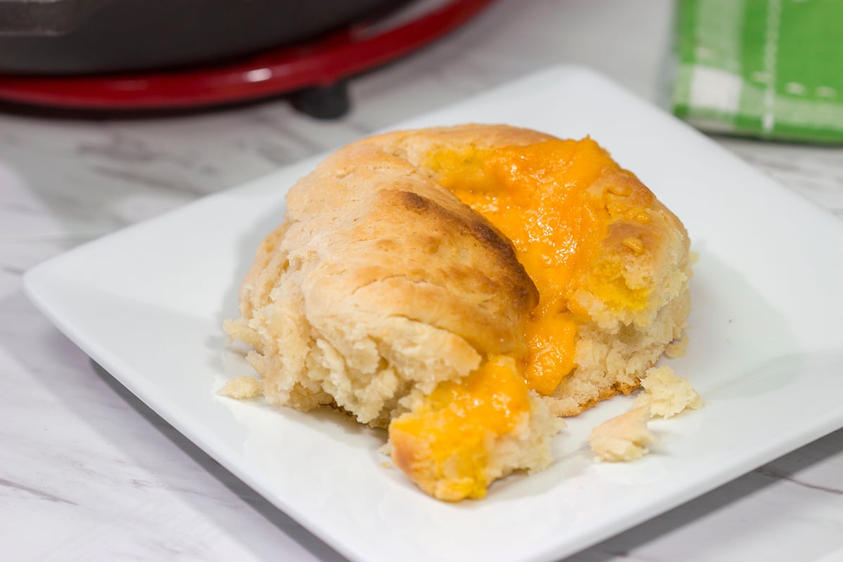 These North Carolina Cathead Biscuits are golden brown and buttery on the outside and soft and fluffy on the inside. Oh, and they're stuffed with cheese!