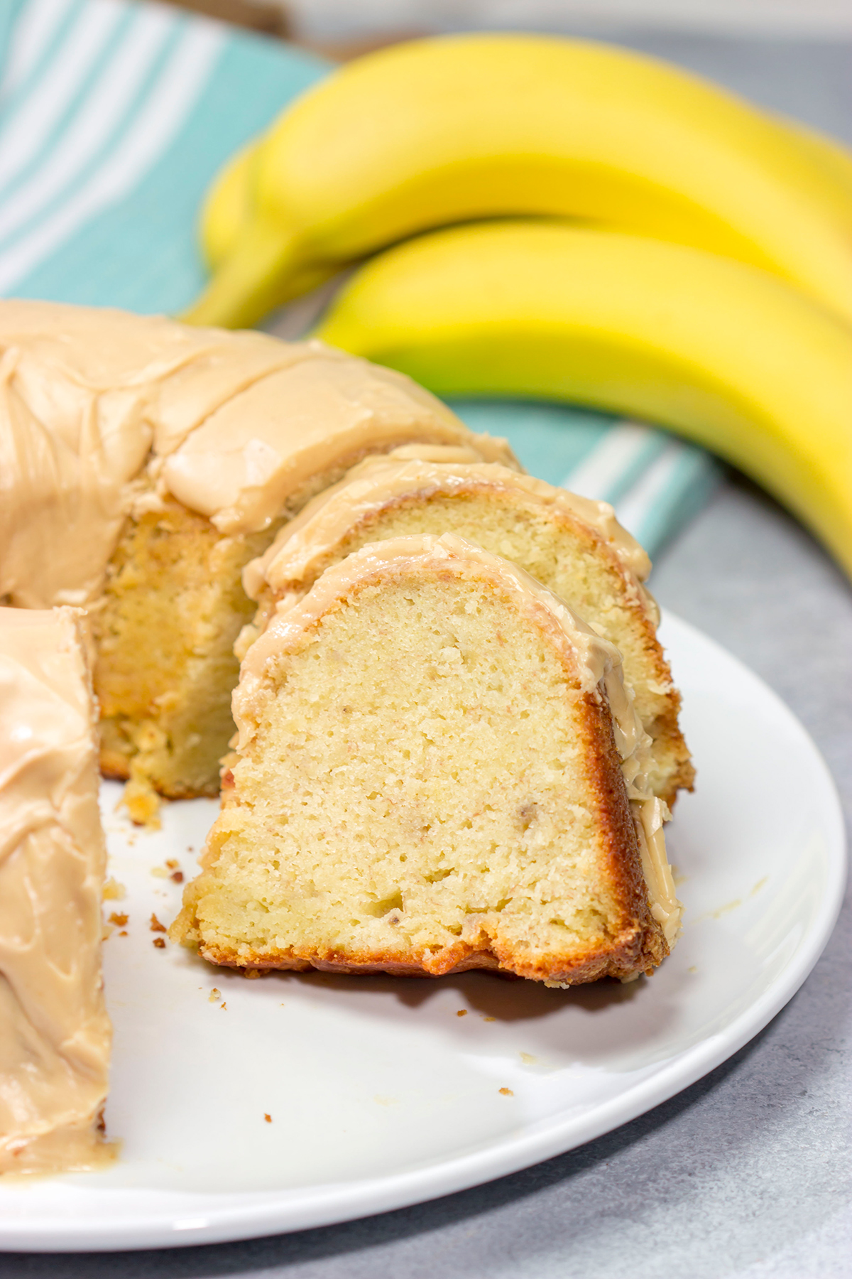 This Banana Pound Cake with Peanut Butter Frosting features a divine banana bread pound cake topped with a delicious peanut butter frosting. I think Elvis would've approved!