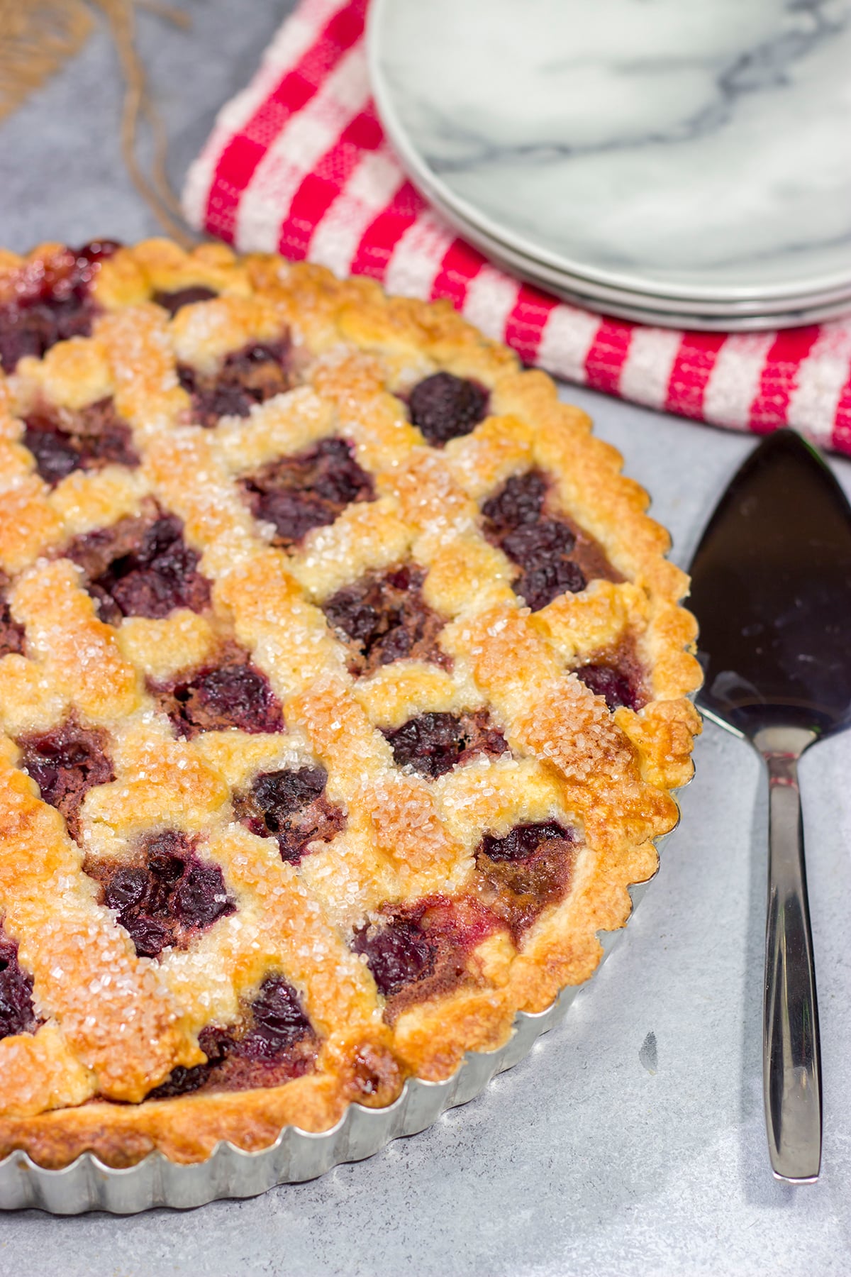 Featuring a sweetened crust that is a cross between shortbread cookie and pie dough, this Sour Cherry Crostata is a delicious dessert for a warm summer day!