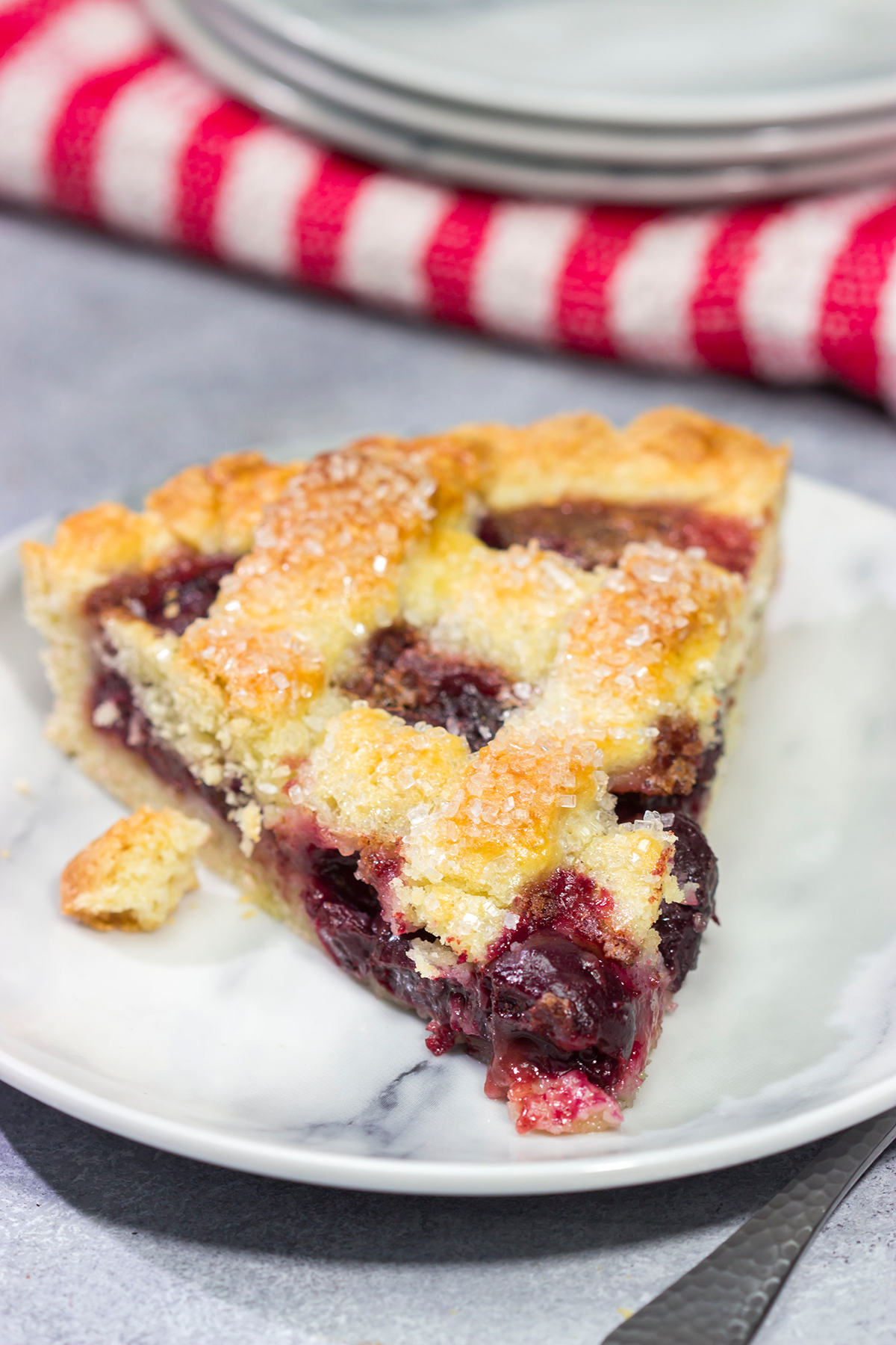 Featuring a sweetened crust that is a cross between shortbread cookie and pie dough, this Sour Cherry Crostata is a delicious dessert for a warm summer day!