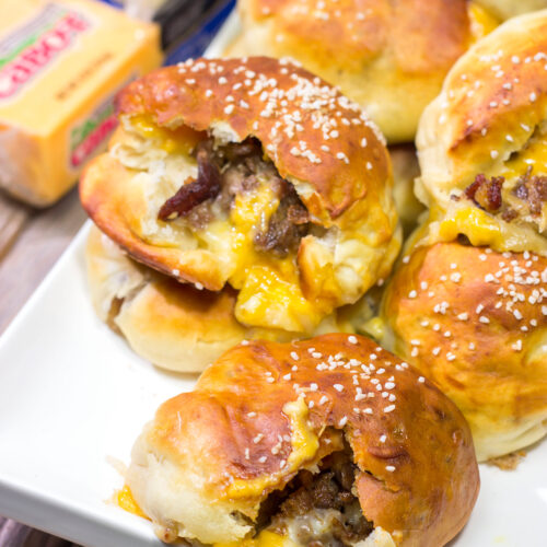 These Steak and Cheese Stuffed Pretzels feature warm, buttery soft pretzels stuffed with shaved steak and two types of cheese! Make a batch today!