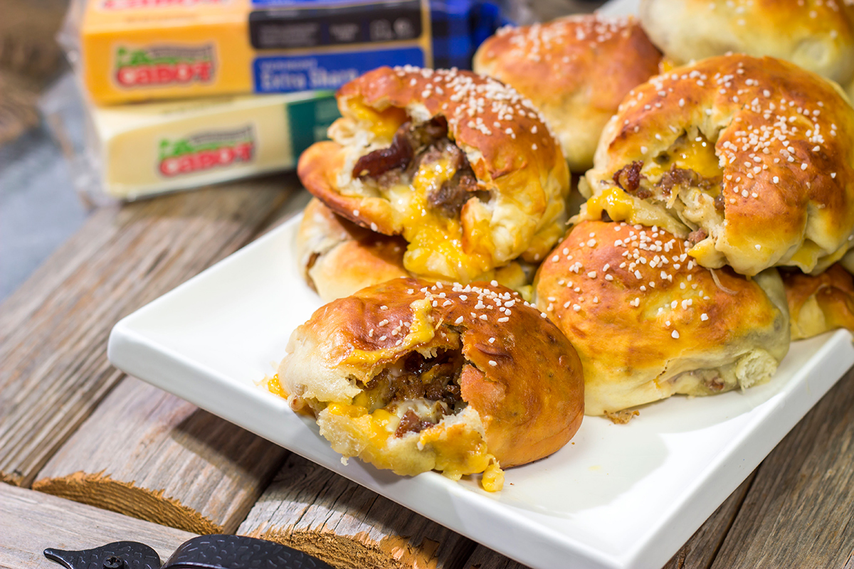 These Steak and Cheese Stuffed Pretzels feature warm, buttery soft pretzels stuffed with shaved steak and two types of cheese! Make a batch today!