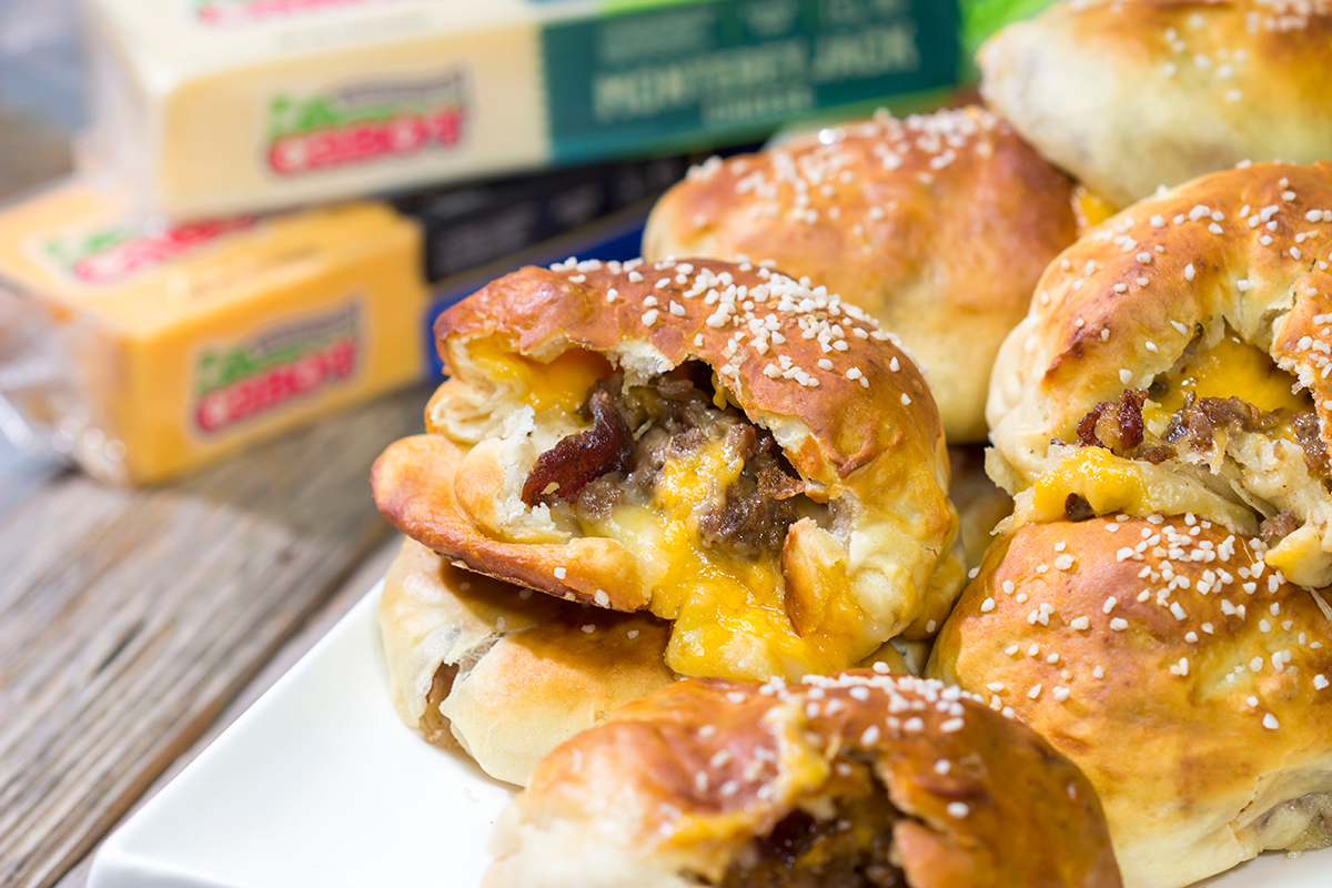 These Steak and Cheese Stuffed Pretzels feature warm, buttery soft pretzels stuffed with shaved steak and two types of cheese! Make a batch today!