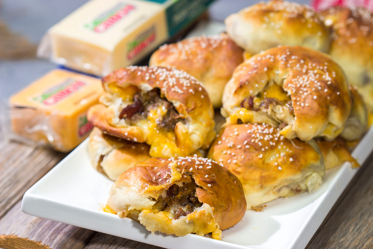These Steak and Cheese Stuffed Pretzels feature warm, buttery soft pretzels stuffed with shaved steak and two types of cheese! Make a batch today!