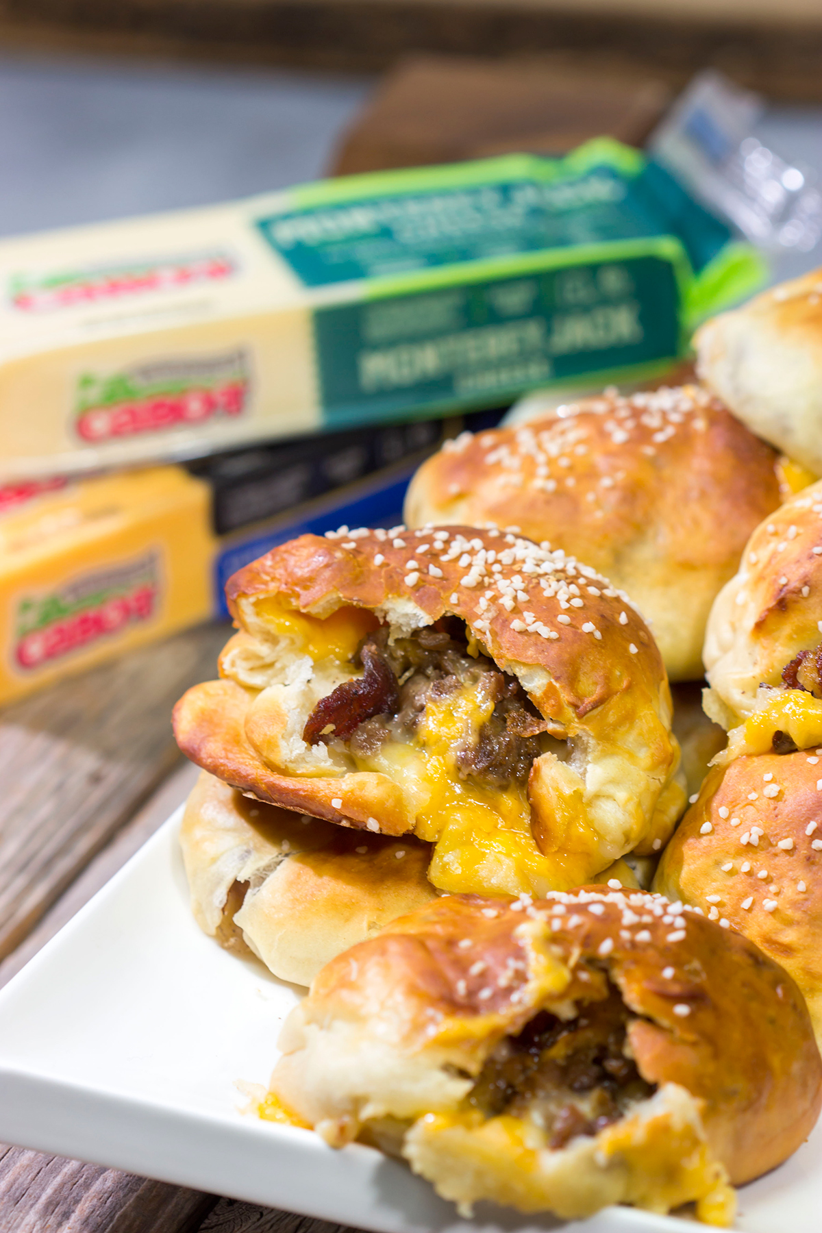 These Steak and Cheese Stuffed Pretzels feature warm, buttery soft pretzels stuffed with shaved steak and two types of cheese! Make a batch today!