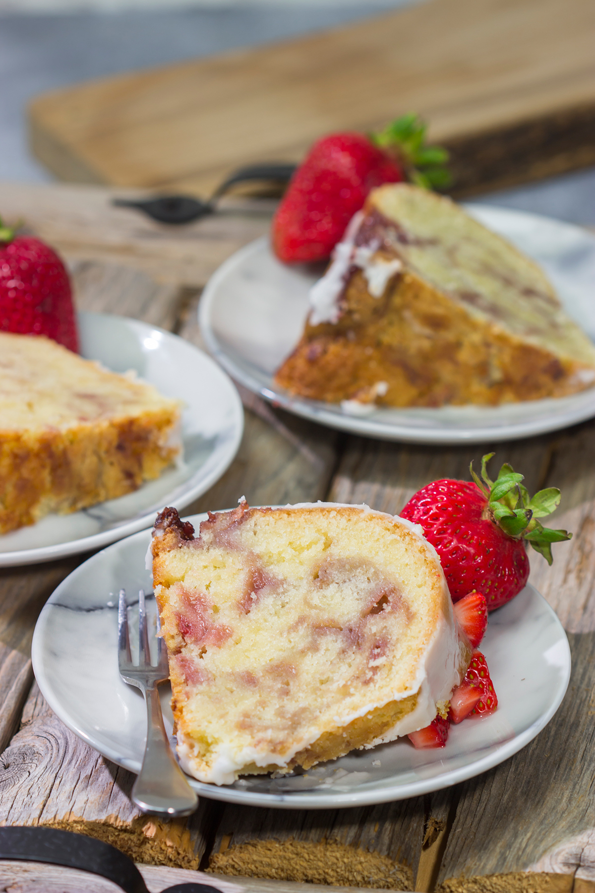 Featuring a sauce made from fresh strawberries swirled into the cake, this Strawberry Swirl Pound Cake makes for a delicious summer dessert!