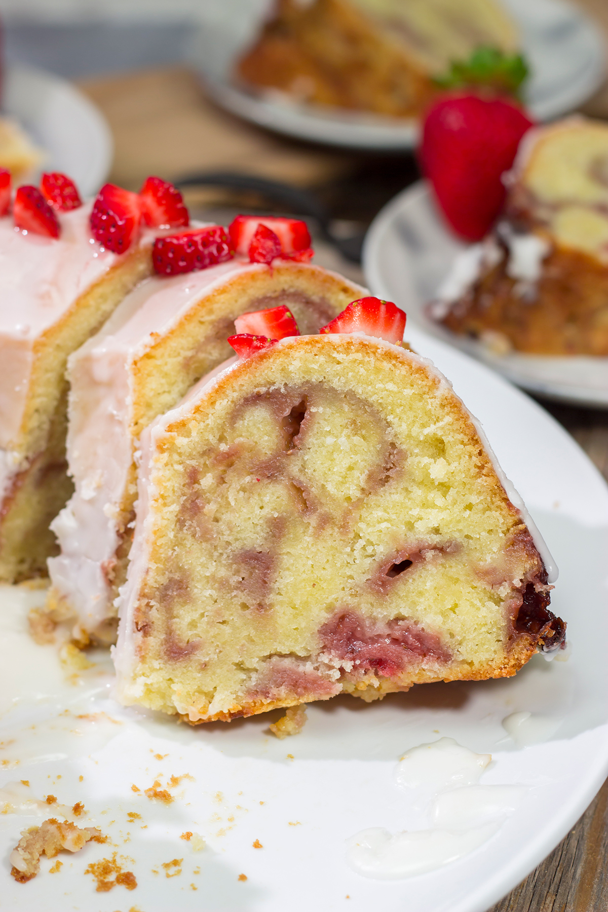 Featuring a sauce made from fresh strawberries swirled into the cake, this Strawberry Swirl Pound Cake makes for a delicious summer dessert!