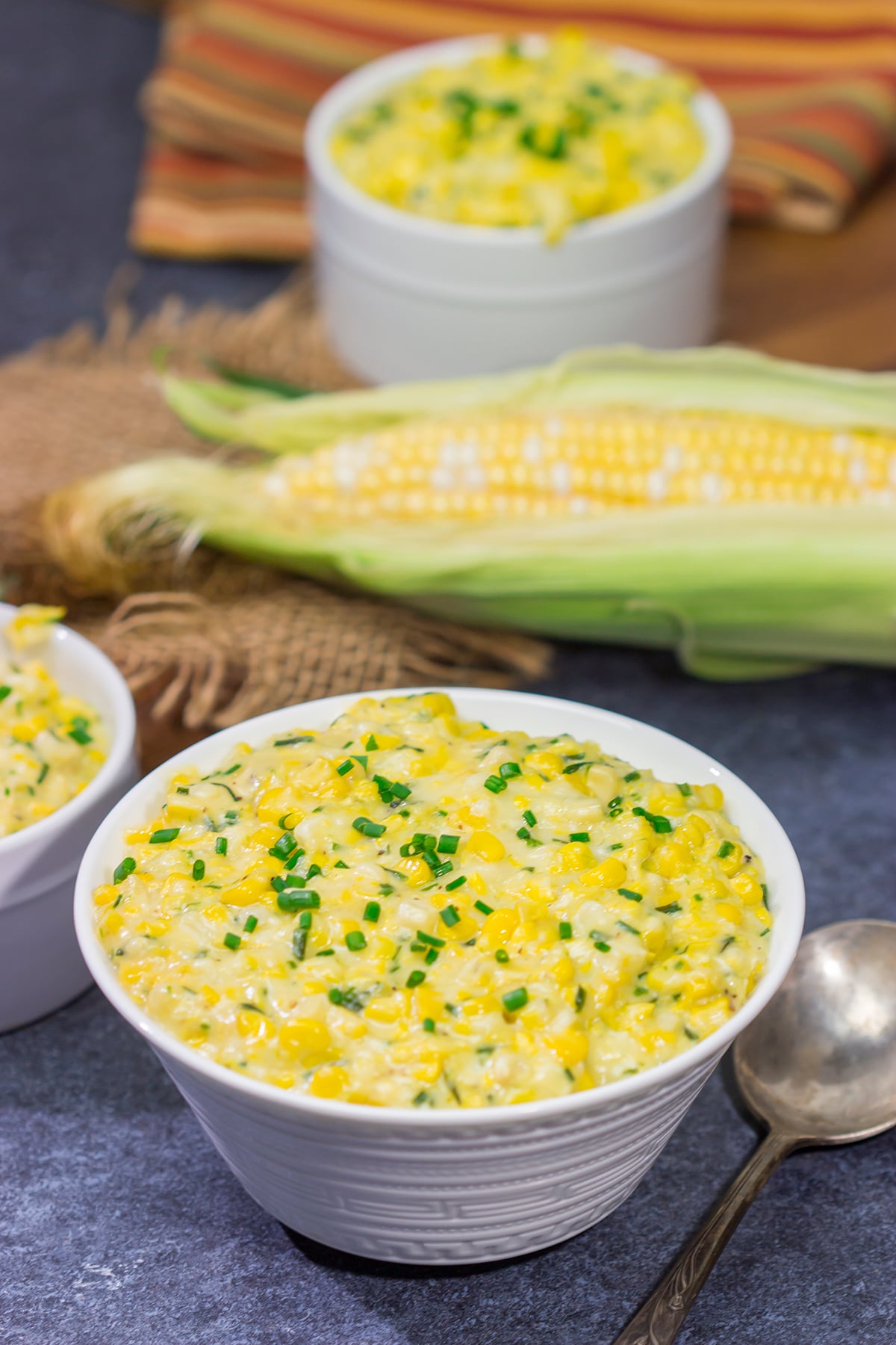 This Cheesy Creamed Corn recipe is a delicious way to celebrate sweet summer corn. Make a batch for dinner tonight!