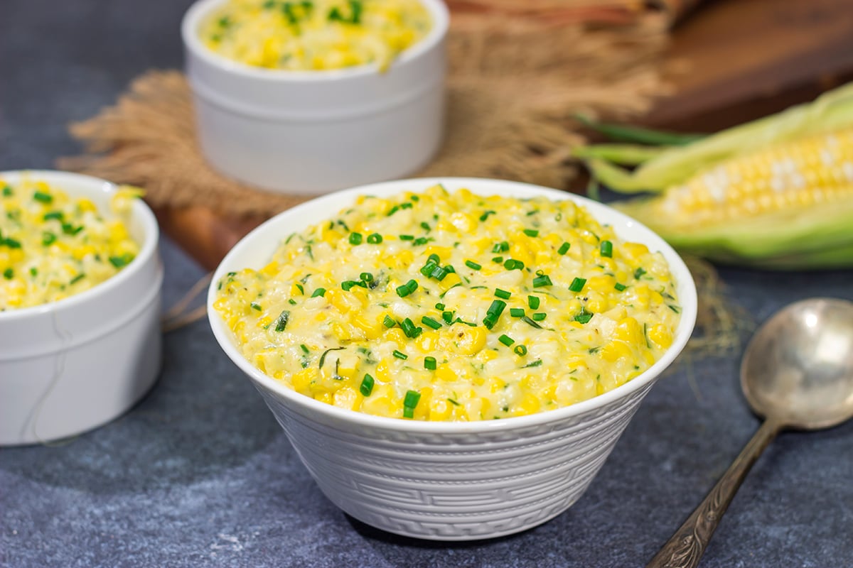 This Cheesy Creamed Corn recipe is a delicious way to celebrate sweet summer corn. Make a batch for dinner tonight!
