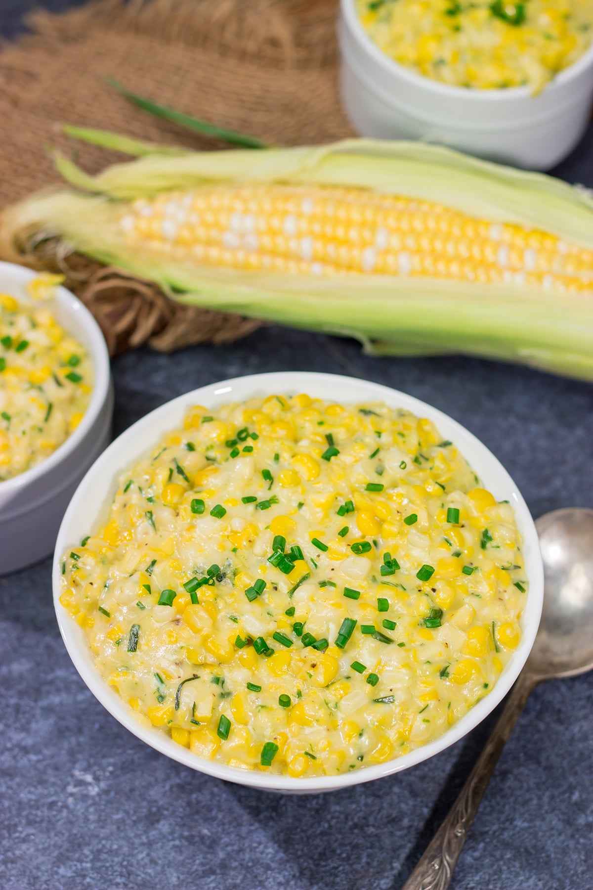 This Cheesy Creamed Corn recipe is a delicious way to celebrate sweet summer corn. Make a batch for dinner tonight!