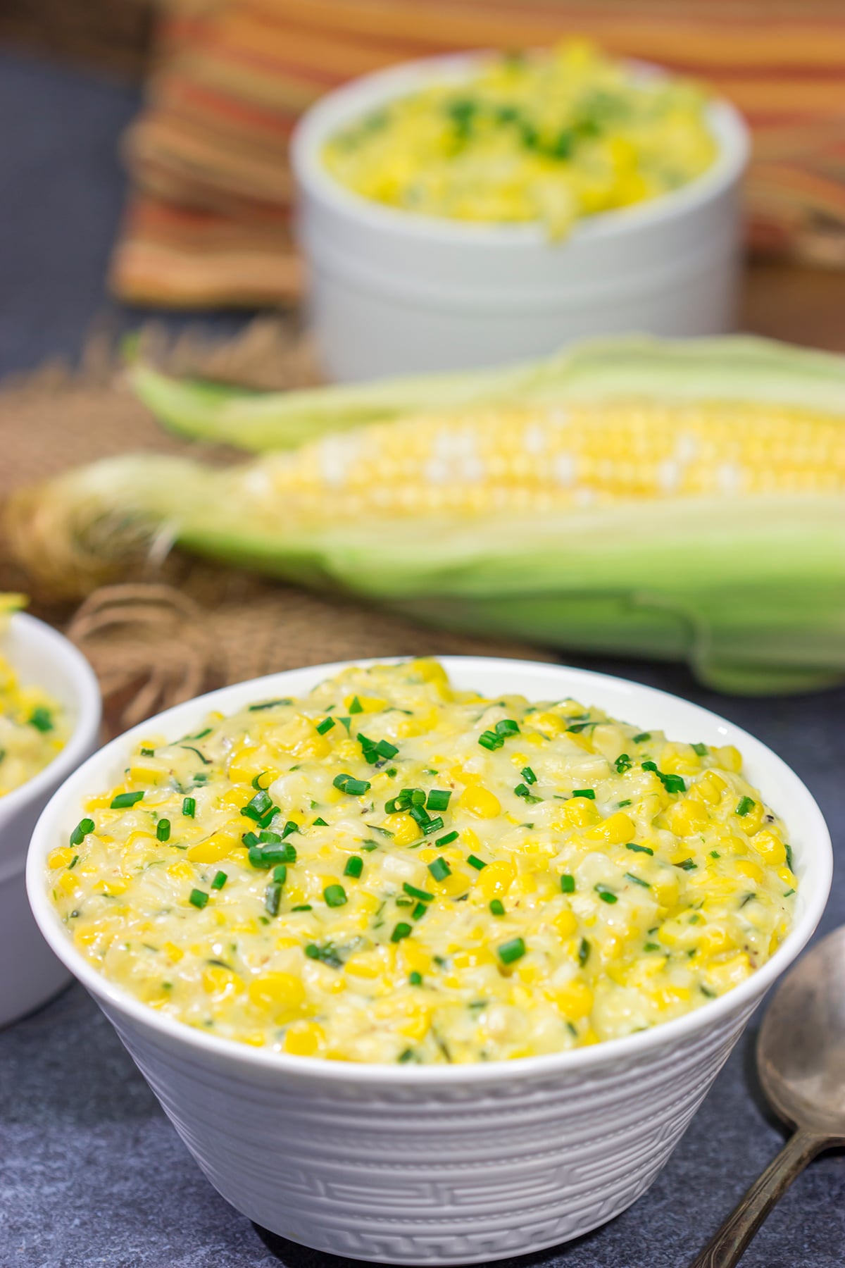 This Cheesy Creamed Corn recipe is a delicious way to celebrate sweet summer corn. Make a batch for dinner tonight!