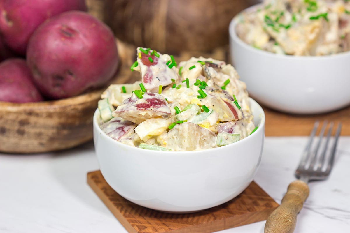 Put a twist on a classic summer side dish! This Caesar Potato Salad uses a bit of creamy Caesar salad dressing for added flavor - it's delicious!