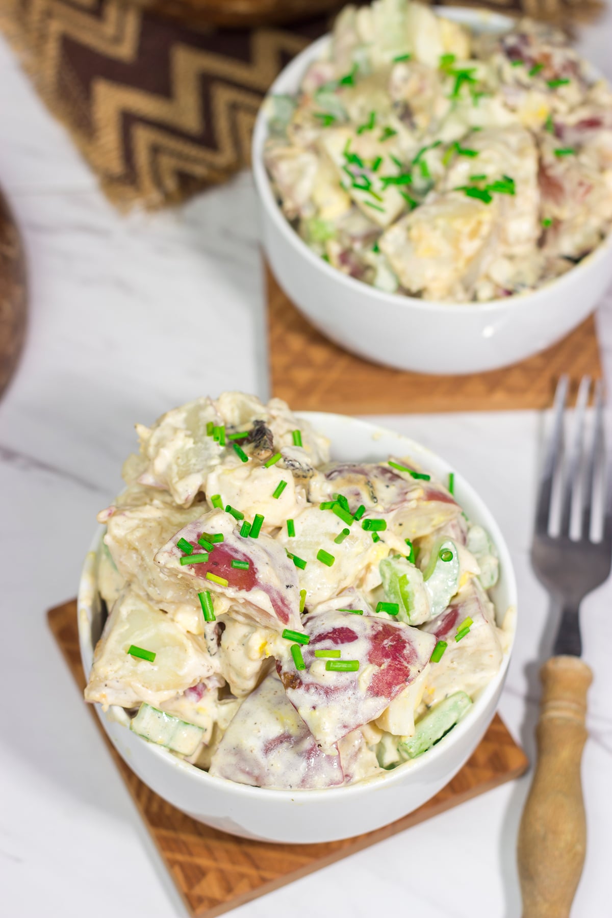 Put a twist on a classic summer side dish! This Caesar Potato Salad uses a bit of creamy Caesar salad dressing for added flavor - it's delicious!