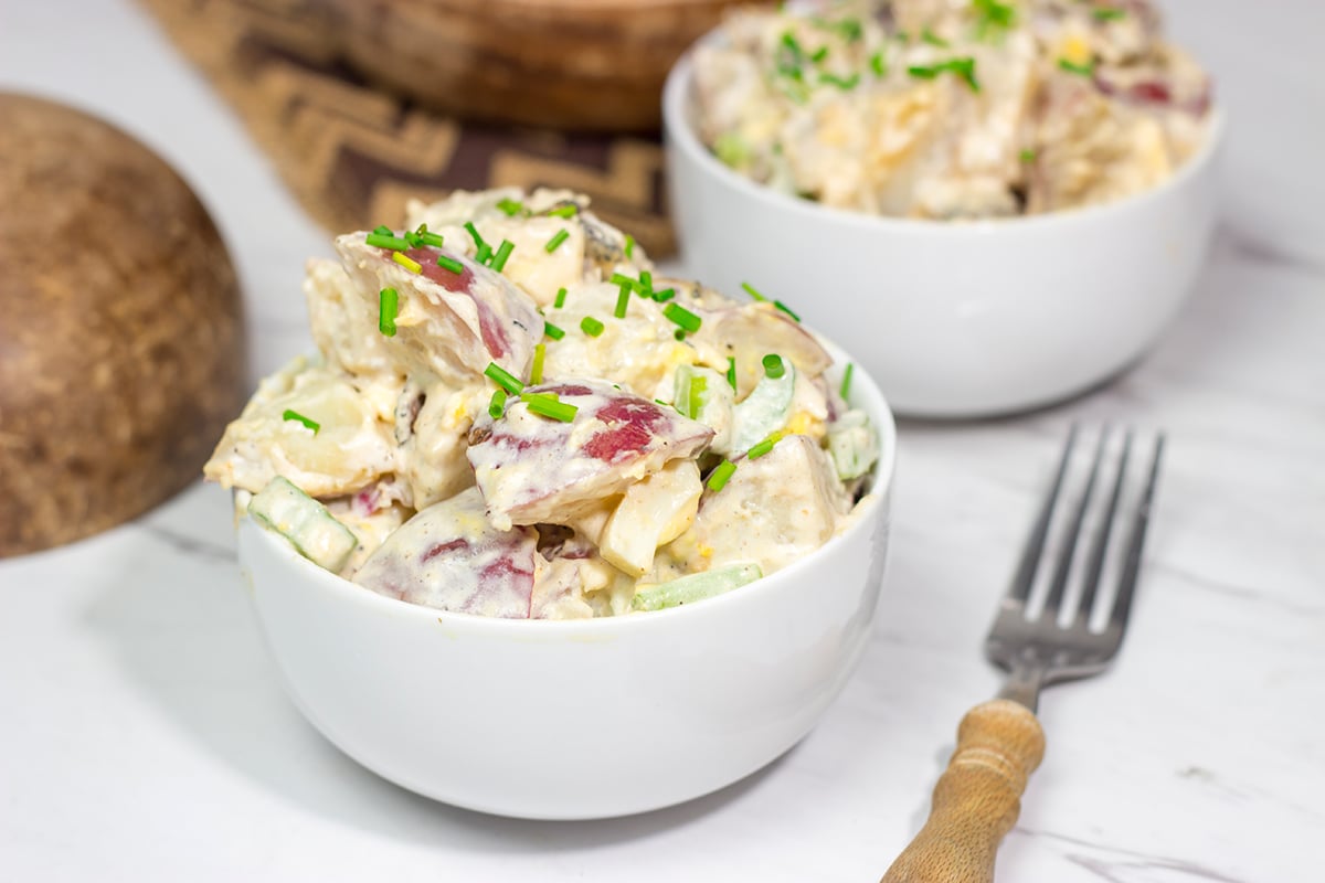 Put a twist on a classic summer side dish! This Caesar Potato Salad uses a bit of creamy Caesar salad dressing for added flavor - it's delicious!