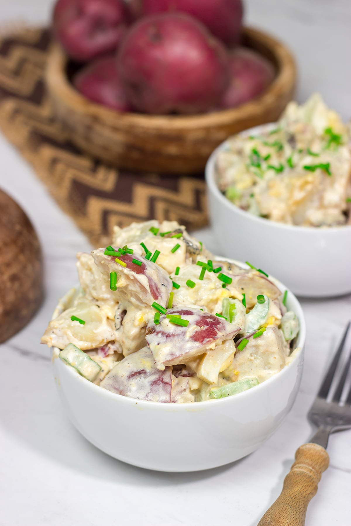 Put a twist on a classic summer side dish! This Caesar Potato Salad uses a bit of creamy Caesar salad dressing for added flavor - it's delicious!