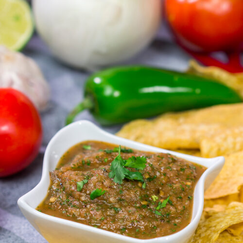 The added smoky flavor from the grill makes this Grilled Tomato Salsa a delicious summer snack!