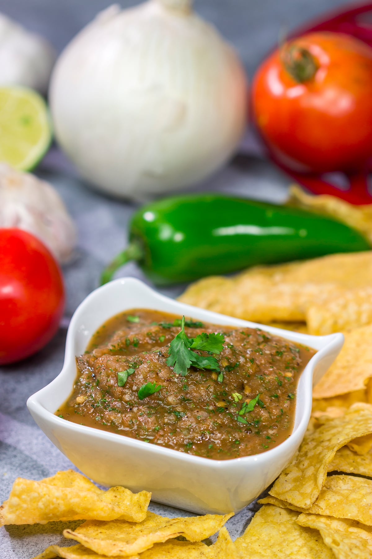 The added smoky flavor from the grill makes this Grilled Tomato Salsa a delicious summer snack!
