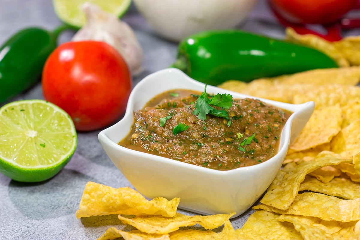 The added smoky flavor from the grill makes this Grilled Tomato Salsa a delicious summer snack!