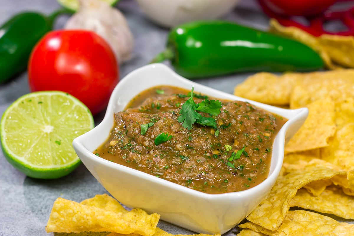 The added smoky flavor from the grill makes this Grilled Tomato Salsa a delicious summer snack!