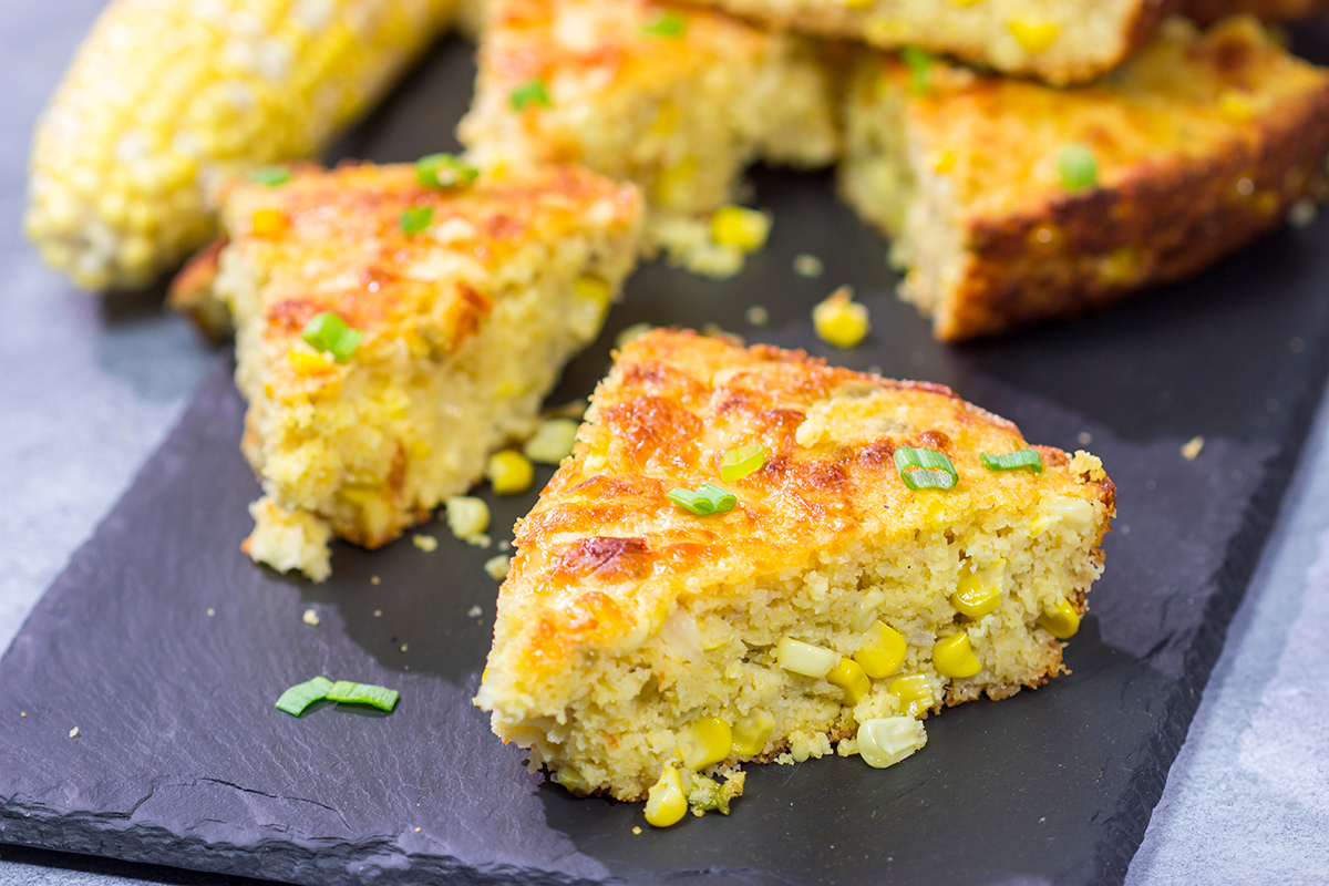 Loaded with cheddar cheese and fresh corn, this Cheesy Skillet Cornbread is a great side dish for late summer or fall meals!
