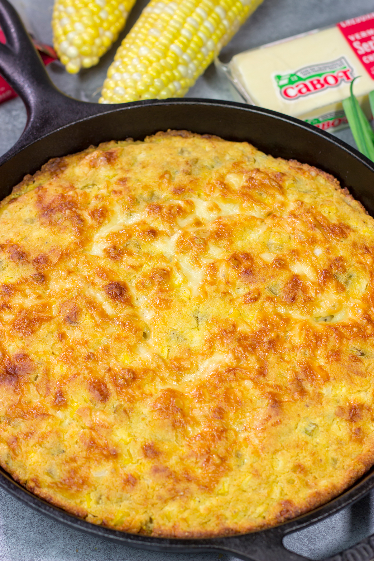 Loaded with cheddar cheese and fresh corn, this Cheesy Skillet Cornbread is a great side dish for late summer or fall meals!
