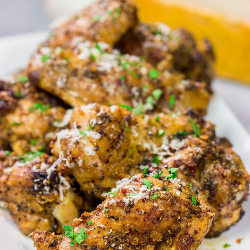 Fire up the grill! These Grilled Garlic Parmesan Chicken Wings are juicy and delicious. Add in the smoky grill flavor, and these grilled wings are perfect for a summer meal!