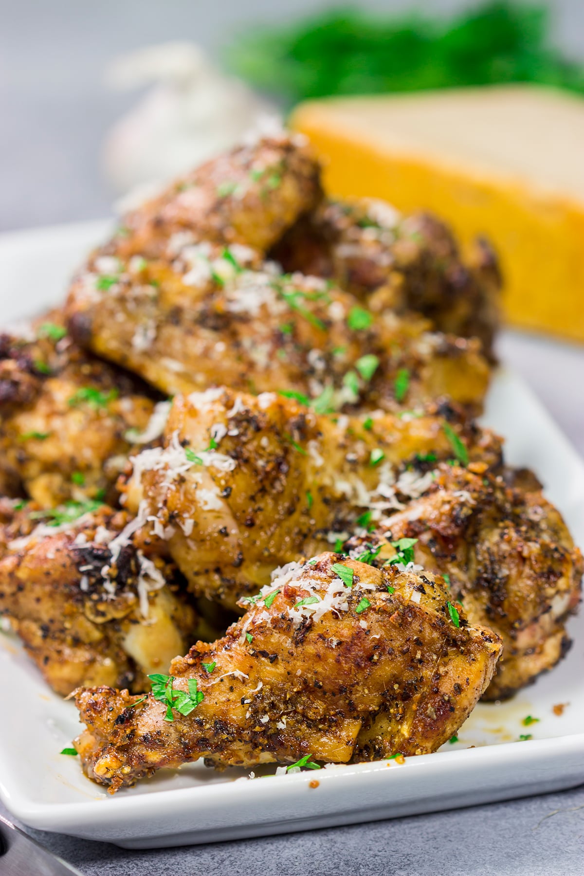 Fire up the grill! These Grilled Garlic Parmesan Chicken Wings are juicy and delicious. Add in the smoky grill flavor, and these grilled wings are perfect for a summer meal!