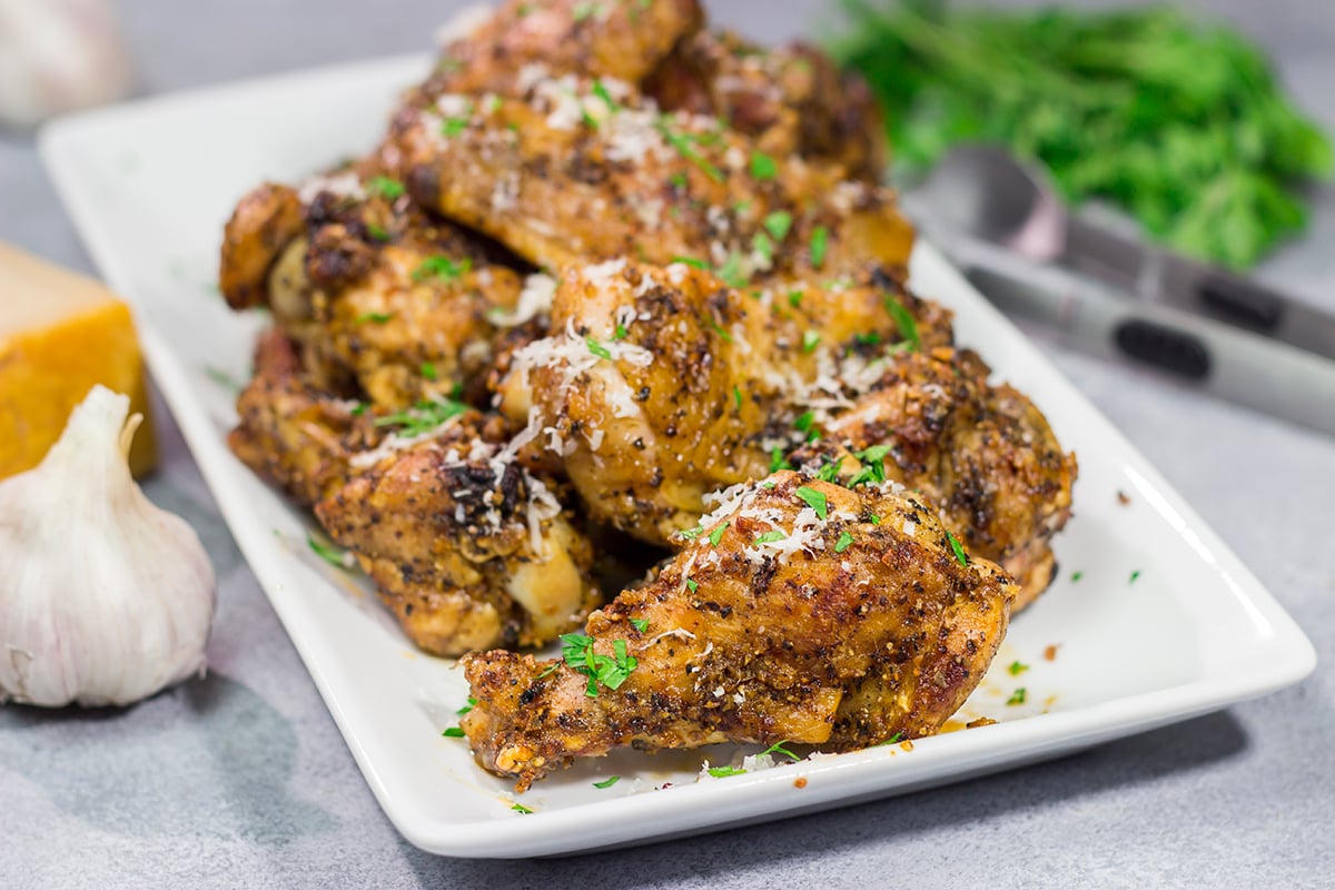 Fire up the grill! These Grilled Garlic Parmesan Chicken Wings are juicy and delicious. Add in the smoky grill flavor, and these grilled wings are perfect for a summer meal!