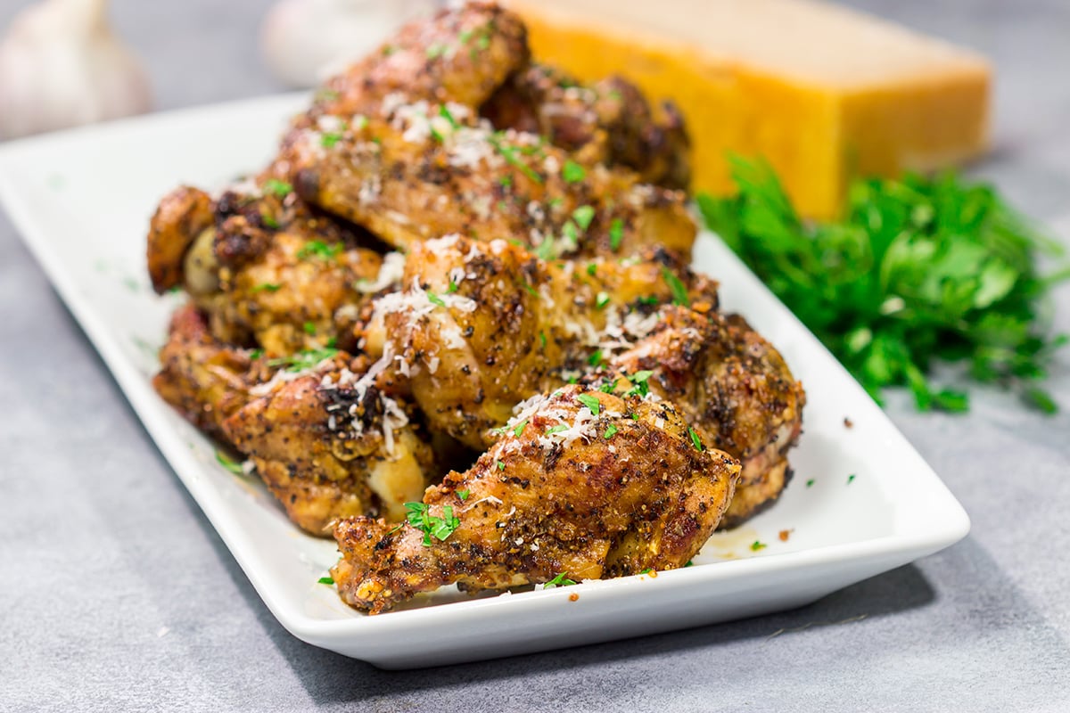 Fire up the grill! These Grilled Garlic Parmesan Chicken Wings are juicy and delicious. Add in the smoky grill flavor, and these grilled wings are perfect for a summer meal!