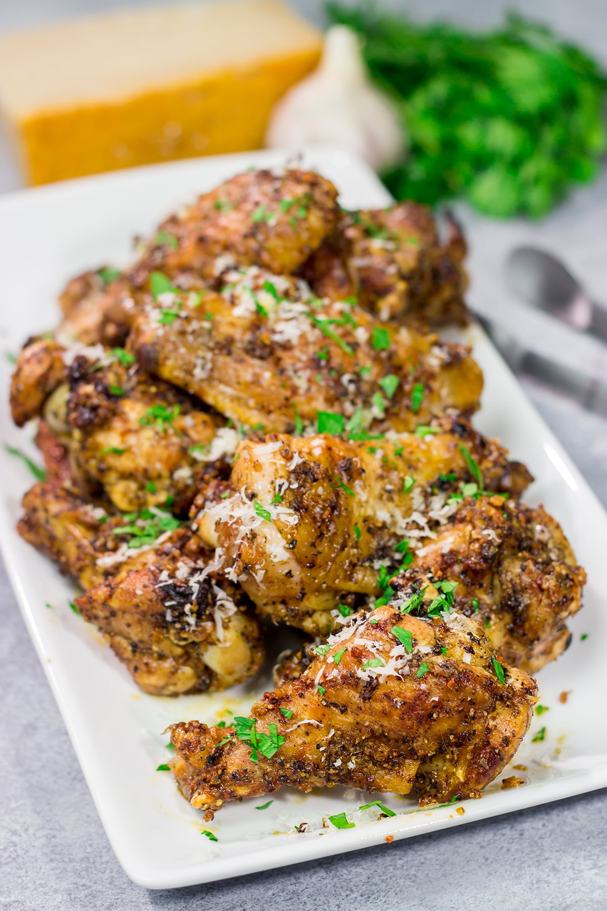 Fire up the grill! These Grilled Garlic Parmesan Chicken Wings are juicy and delicious. Add in the smoky grill flavor, and these grilled wings are perfect for a summer meal!