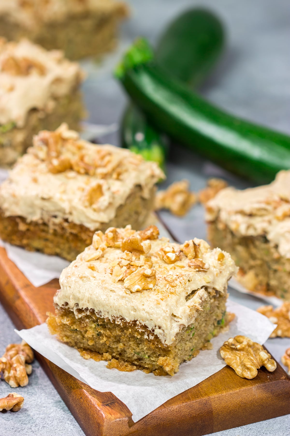 Looking for a way to use up extra zucchini? Bake it into a cake! This Zucchini Cake with Cream Cheese Frosting is a favorite dessert in our house every summer!