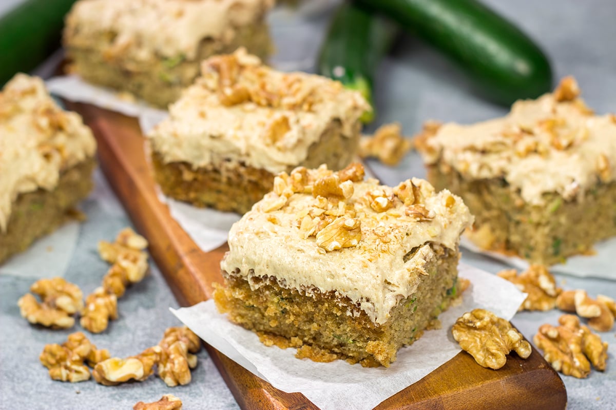 Looking for a way to use up extra zucchini? Bake it into a cake! This Zucchini Cake with Cream Cheese Frosting is a favorite dessert in our house every summer!