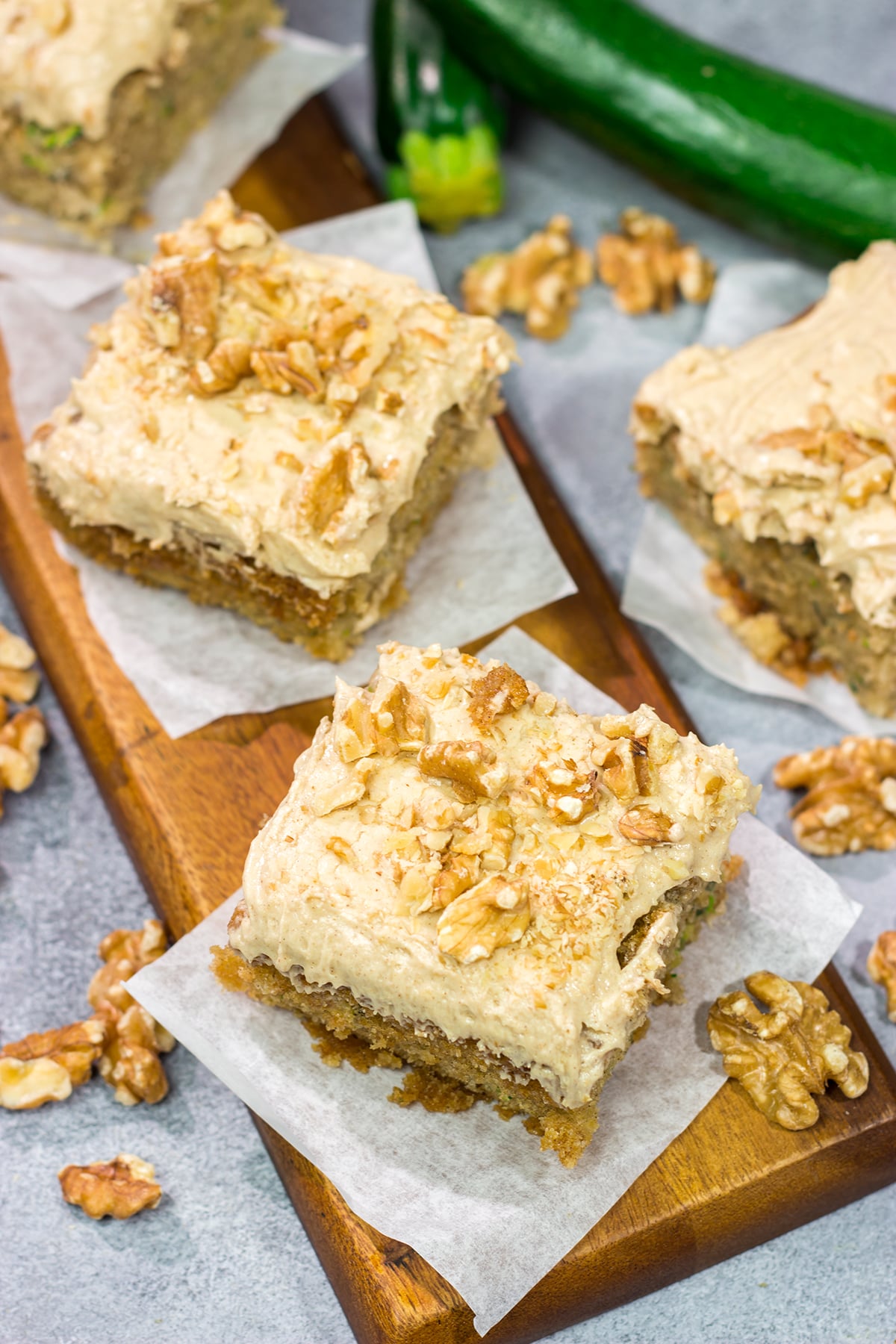 Looking for a way to use up extra zucchini? Bake it into a cake! This Zucchini Cake with Cream Cheese Frosting is a favorite dessert in our house every summer!