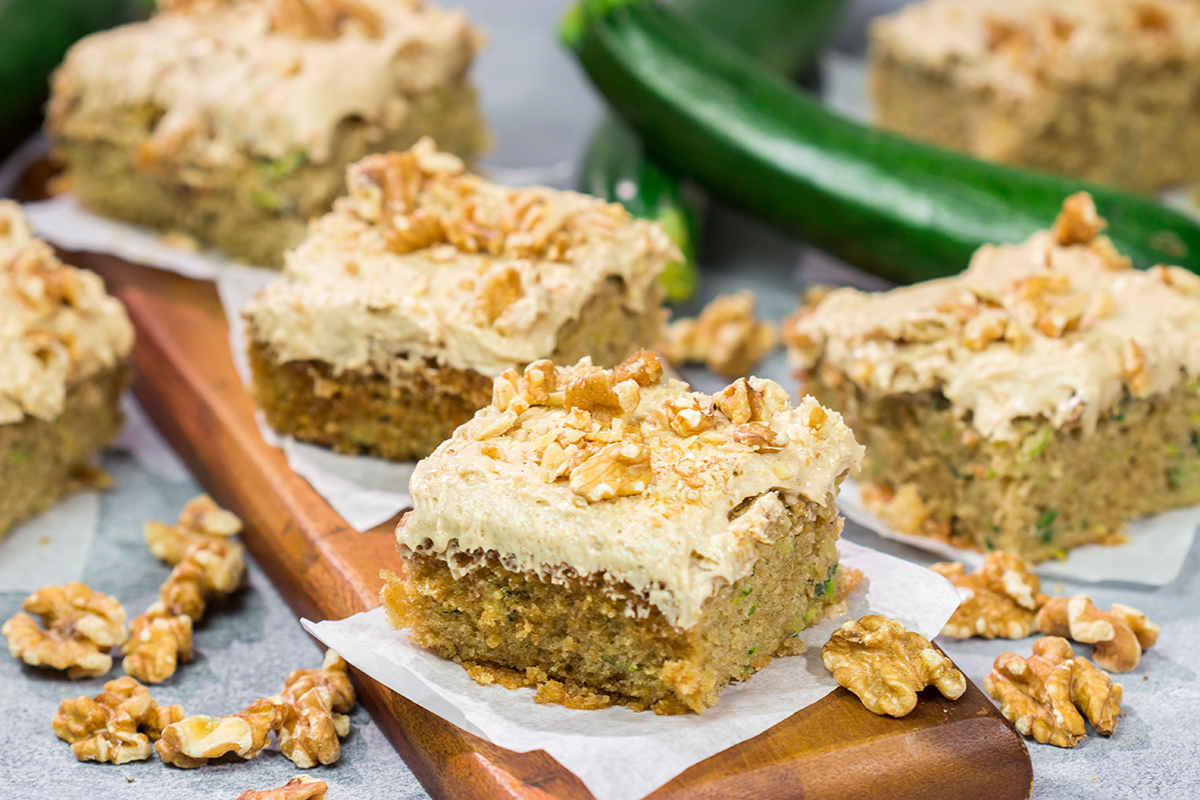 Looking for a way to use up extra zucchini? Bake it into a cake! This Zucchini Cake with Cream Cheese Frosting is a favorite dessert in our house every summer!