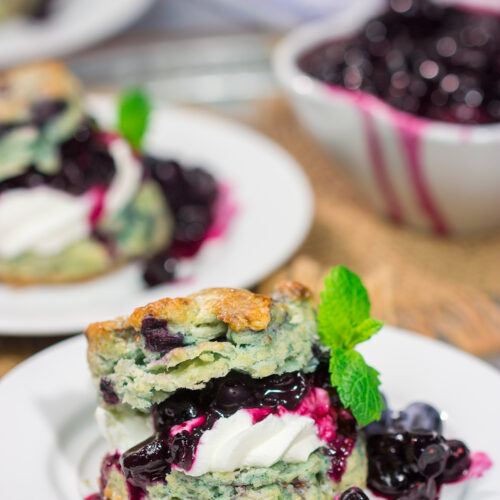 These Blueberry Shortcakes feature buttery biscuits filled with whipped cream and blueberry sauce. This recipe is great for summer brunch or dessert!