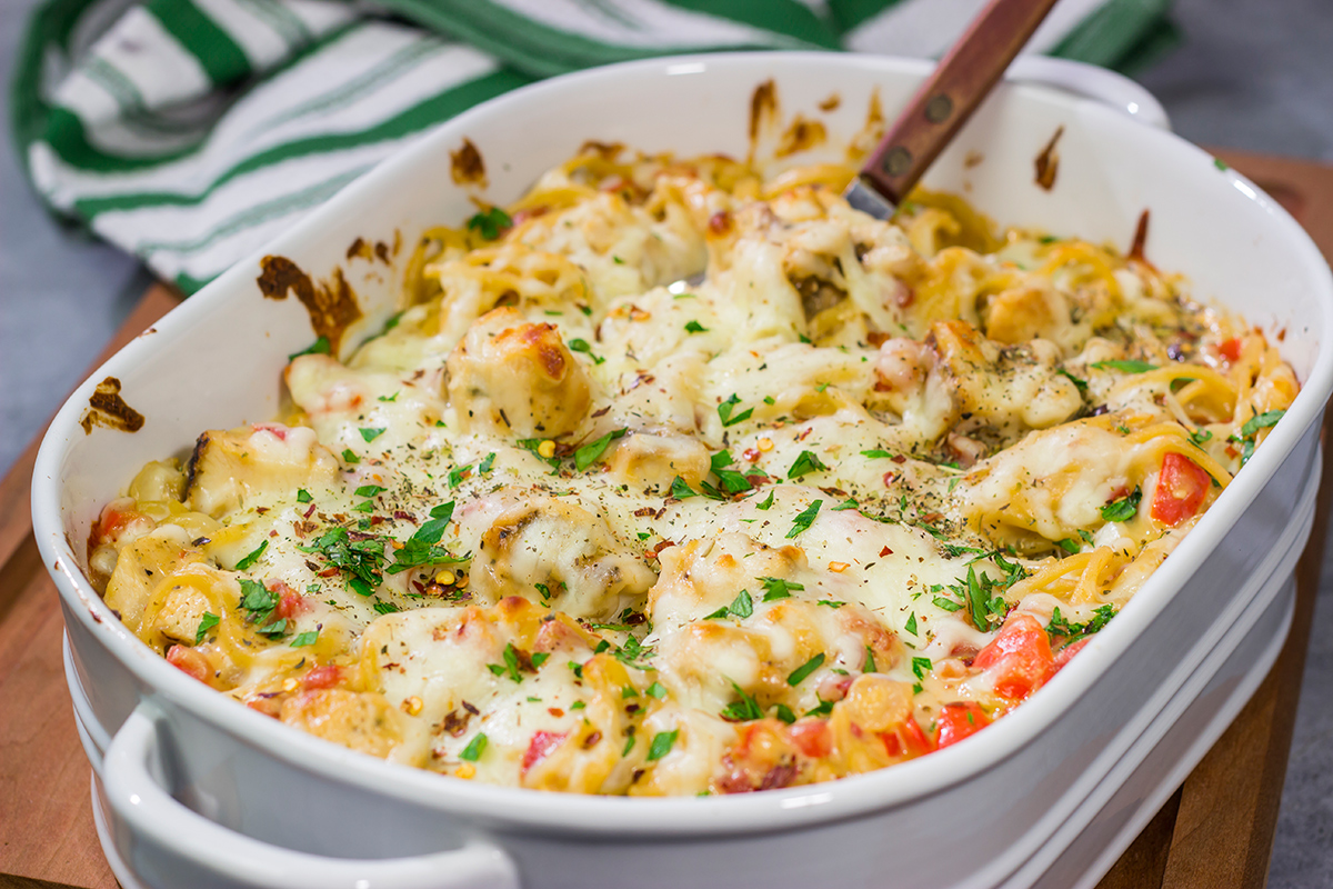 This Chicken Spaghetti features bite-sized pieces of tender chicken tossed in a creamy, cheesy sauce. This recipe is comfort food at its best!