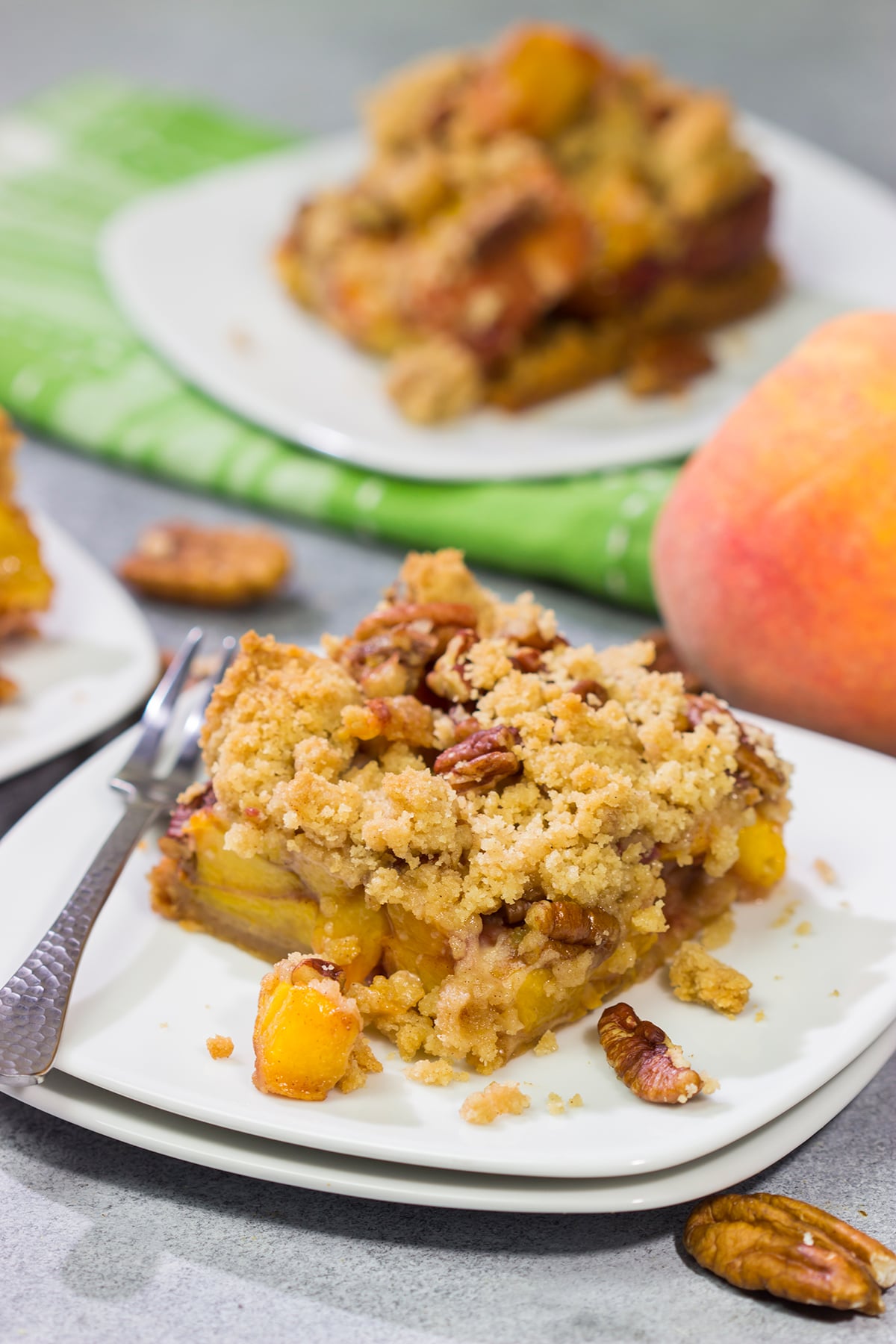 It's fresh peach season! These easy Peach Crumble Bars make for a fantastic summer dessert. Grab some peaches and get a batch of these bars in the oven today!
