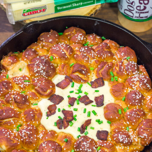 This Pull Apart Pretzel Skillet features warm, soft pretzels served with Beer Cheese. It's the perfect way to celebrate Oktoberfest and Autumn days in general!